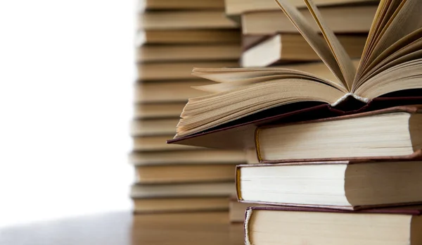 Books on wooden deck tabletop Stock Photo