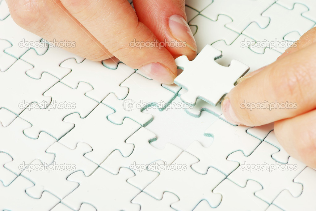 hands holding puzzle 