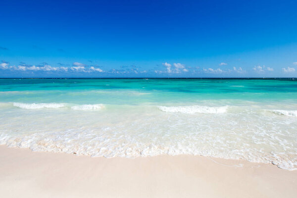 tropical Maldives island with white sandy beach and sea