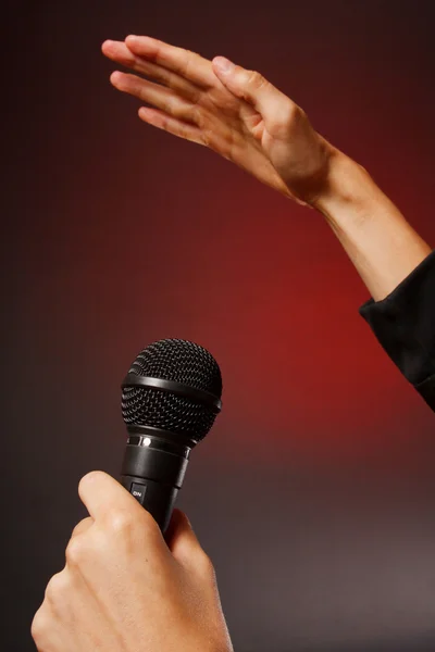 Microphone in hand — Stock Photo, Image