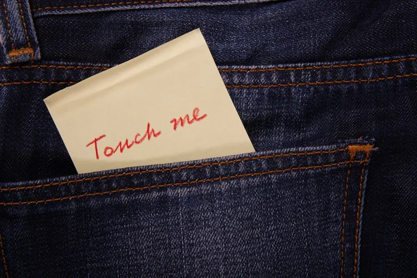 Sticker in your pocket jeans. The text - Touch Me — Stock Photo, Image