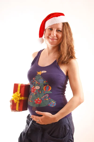 Pregnant woman in Christmas hat — Stock Photo, Image