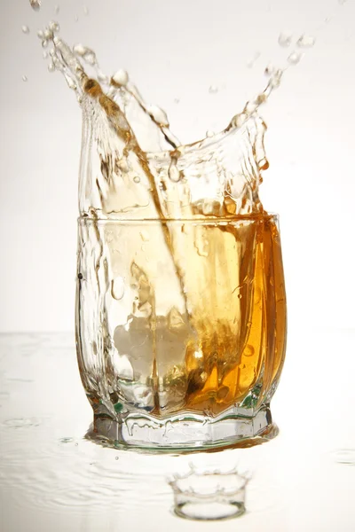 Splashing into a brandy — Stock Photo, Image
