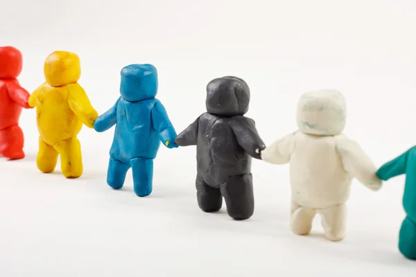 Plasticine mannetjes staan op een rij Rechtenvrije Stockfoto's