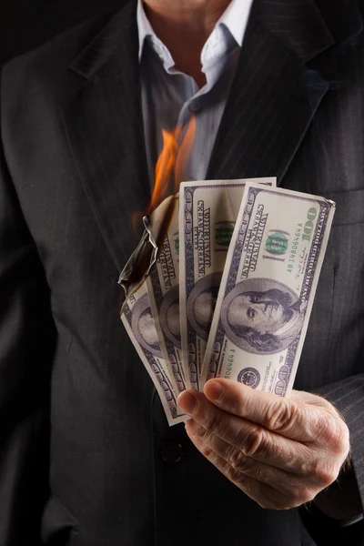 Burning dollars in hand — Stock Photo, Image