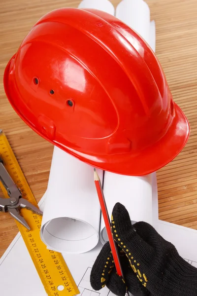 Hardhat on blueprint — Stock Photo, Image