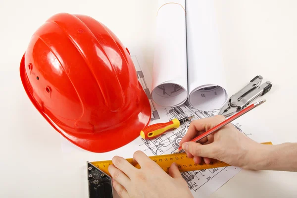 Hardhat on blueprint — Stock Photo, Image