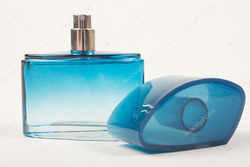 perfume in blue bottle ⬇ Stock Photo 