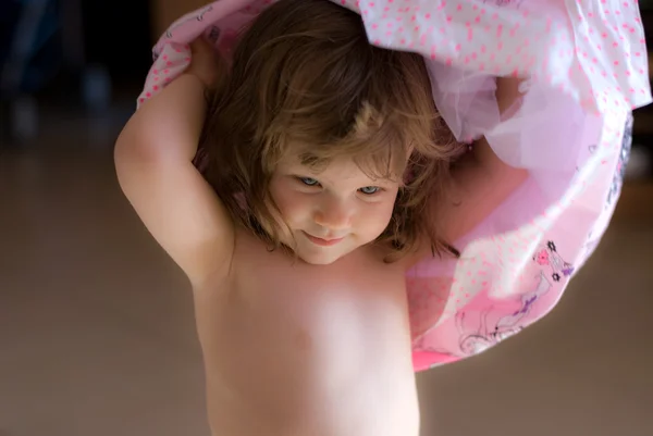 Beautiful little girl wearing a pink dress — Stock Photo, Image