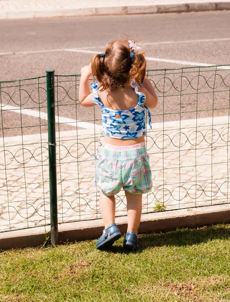 The baby girl walking alone in park — Stock Photo, Image