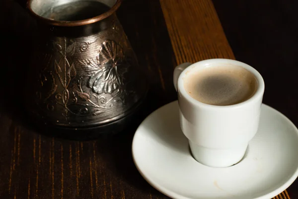 Turkish coffe pot with cup of coffe — Stock Photo, Image