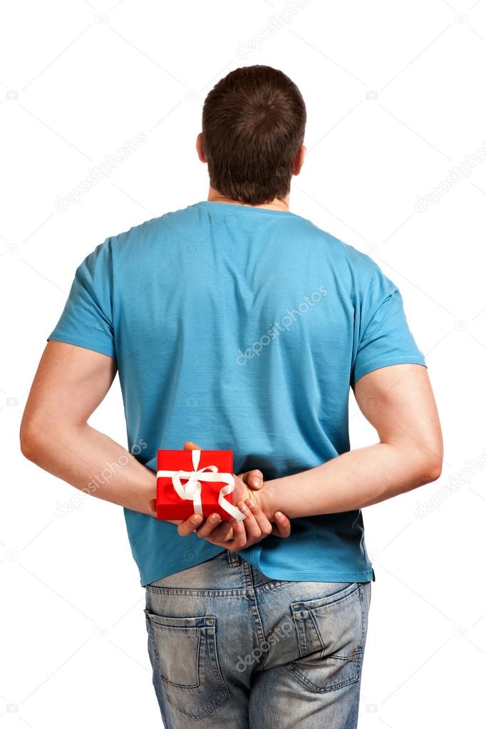 Man with a gift in hand. View from the back.