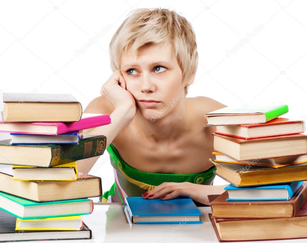 Young student woman with lots of books studying for exams — Stock Photo