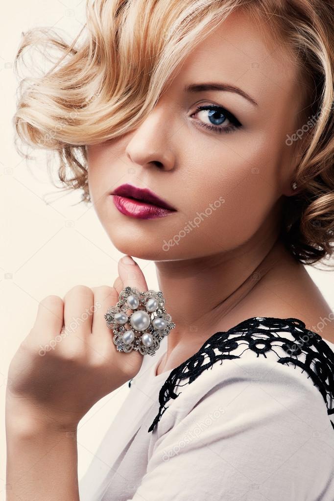 portrait of a beautiful girl with a pearl ring