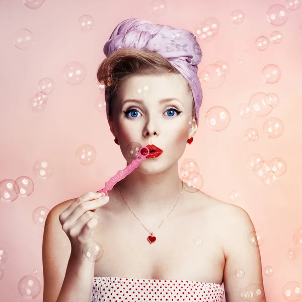 Beautiful young sexy pin-up girl with surprised expression, on white background — Stock Photo, Image