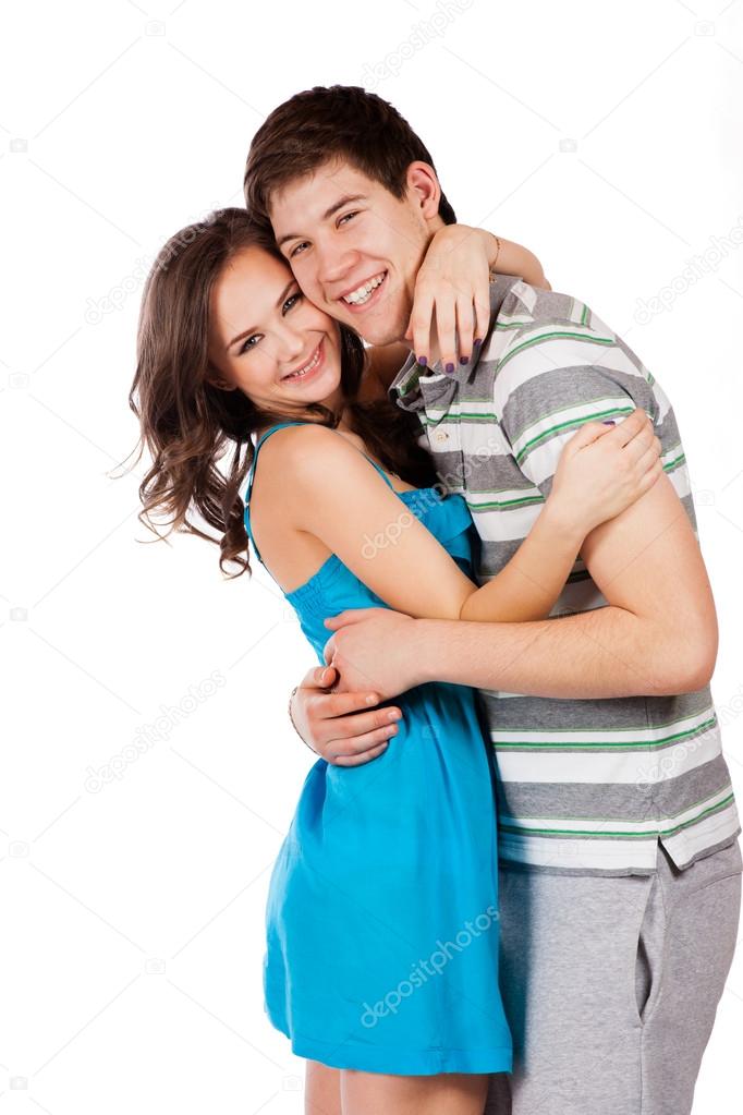 Cheerful young couple standing on white background, isolated