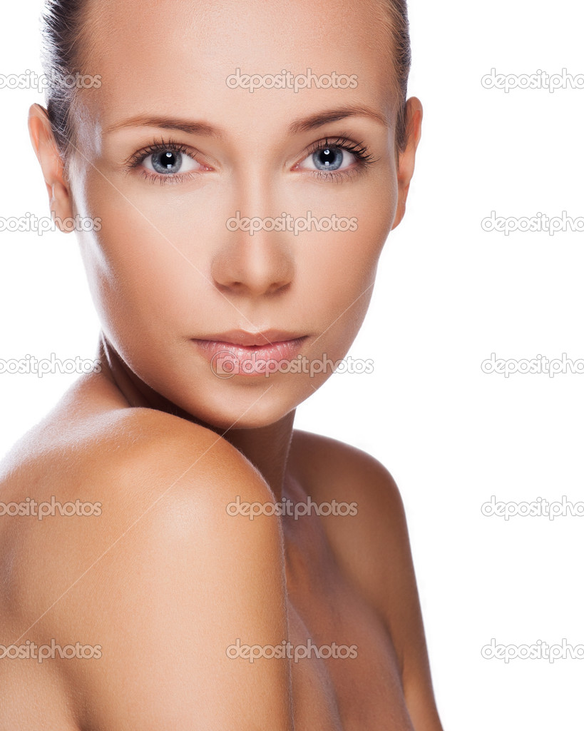 Beautiful woman cares for the skin face - posing at studio isolated on white