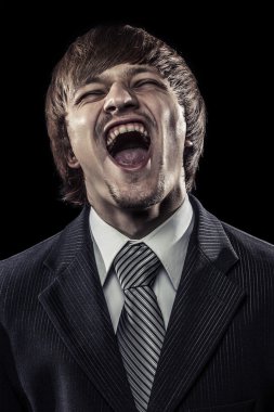 Young successful businessman laughing hard over black clipart