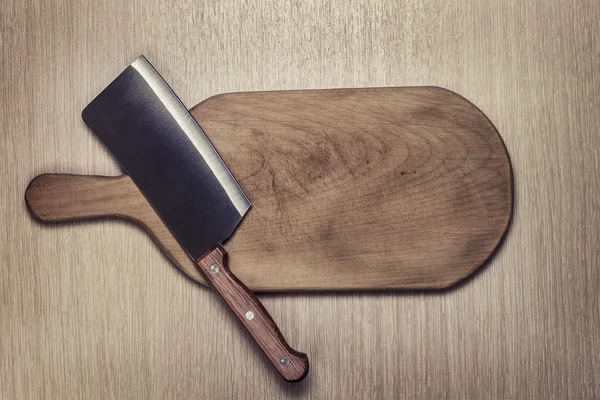 Knife and cutting board used condition stylized — Stock Photo, Image