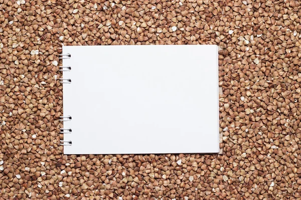 Buckwheat with blank notepad — Stock Photo, Image