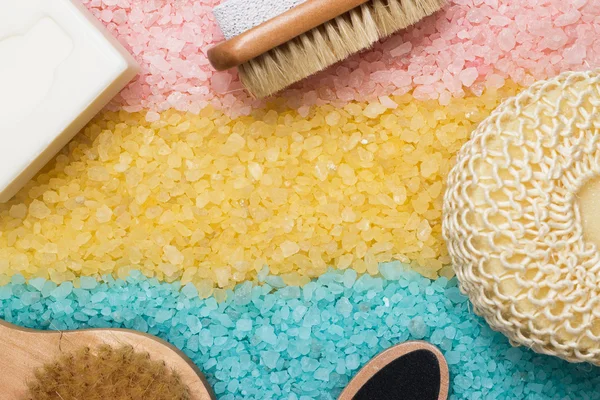 Pink blue yellow bath salt and bath accessories — Stock Photo, Image