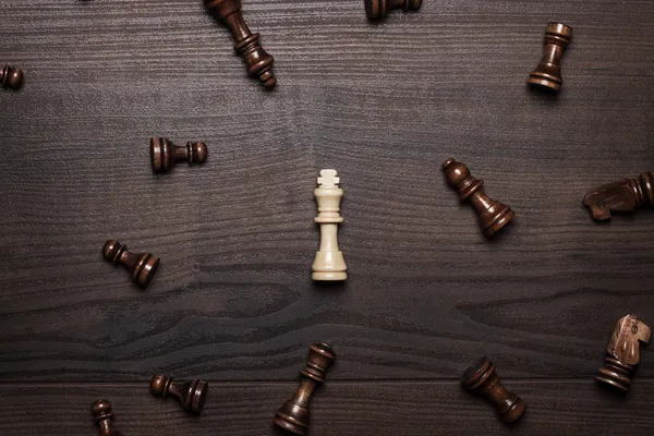 Chess figures on the brown woden table concept — Stock Photo, Image