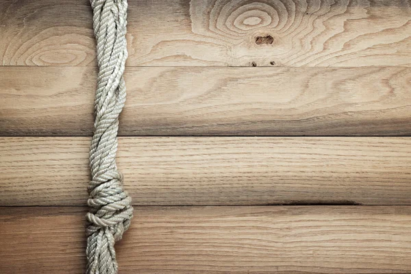 Old wooden background with ship rope — Stock Photo, Image