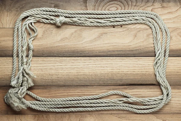 Old wooden background with ship rope — Stock Photo, Image