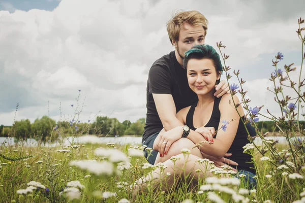 Happy love couple on the grass — Stok Foto