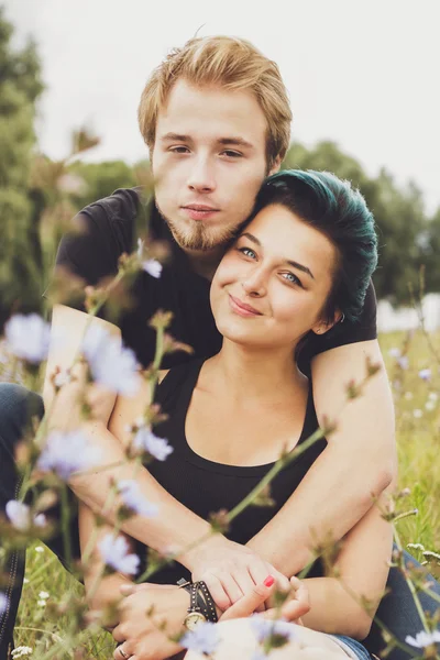 Happy loving couple on the grass — Stock Photo, Image
