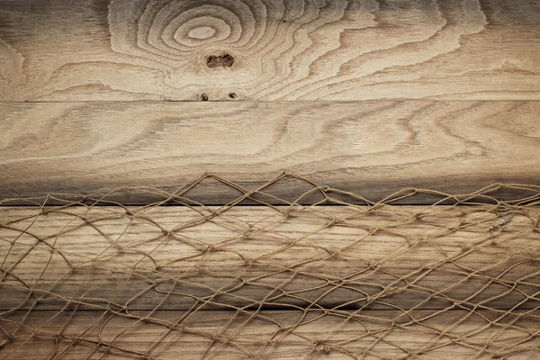 Textura de fondo de madera y red de pesca — Foto de Stock