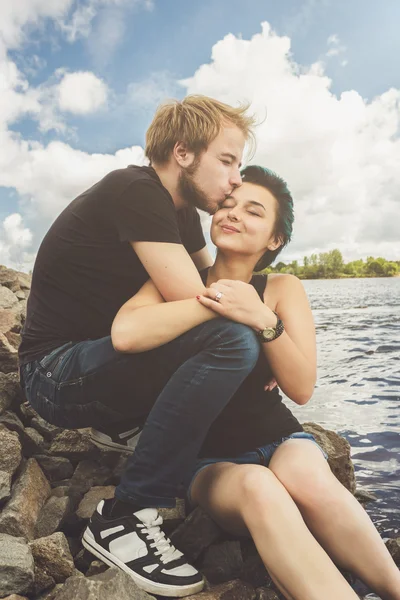 Happy loving couple on the river bank — Stock Photo, Image