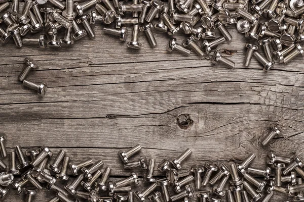 Bulloni sul tavolo di legno — Foto Stock