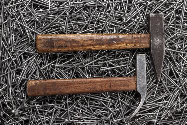 Old hammers and nails on table — Stock Photo, Image