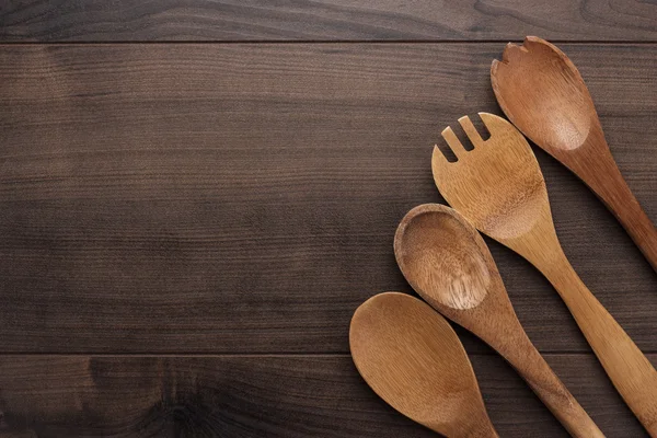 Cucharas de madera en la mesa azul —  Fotos de Stock