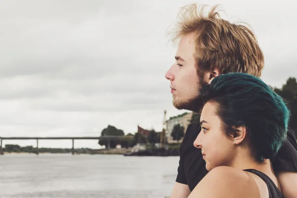 Happy loving couple on the river bank — Stock Photo, Image