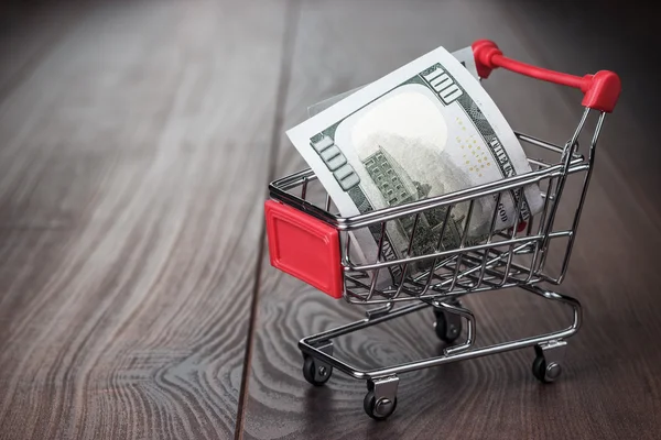 A hundred dollars in the shopping trolley — Stock Photo, Image