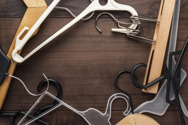 Clothing hanger on brown table — Stock Photo, Image