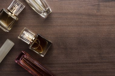 different perfume bottles on the table clipart