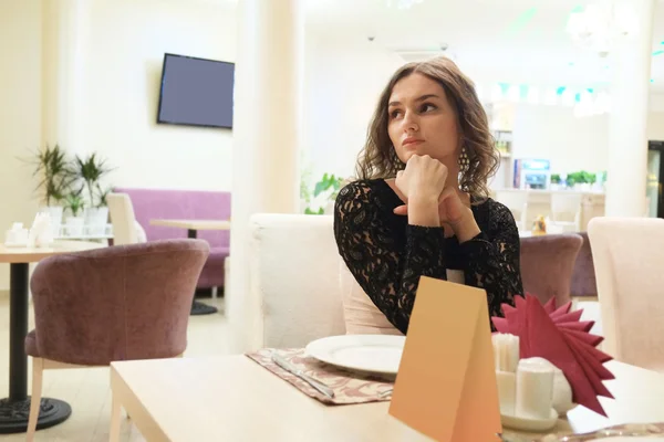 Girl in a restaurant — Stock Photo, Image