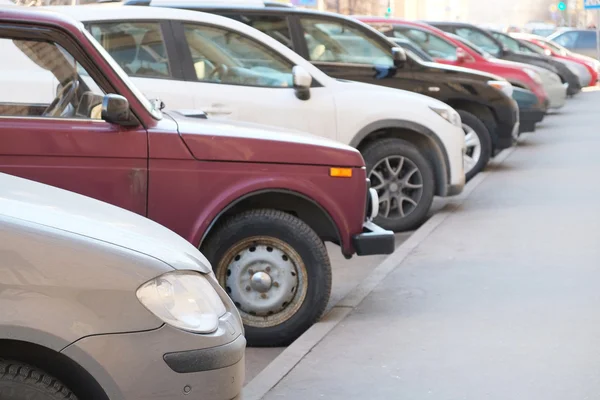 Vehicles parked in parking lot — Stock Photo, Image