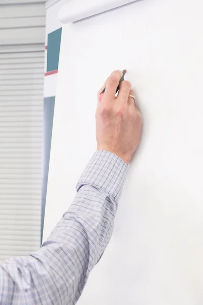 Hand writes on the white board Stock Photo