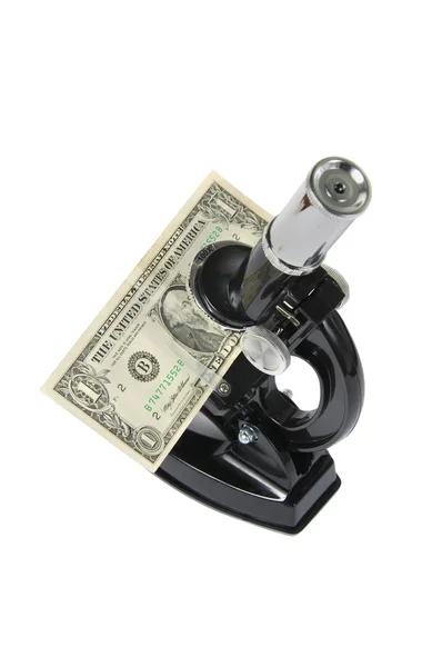 Microscope with dollar — Stock Photo, Image