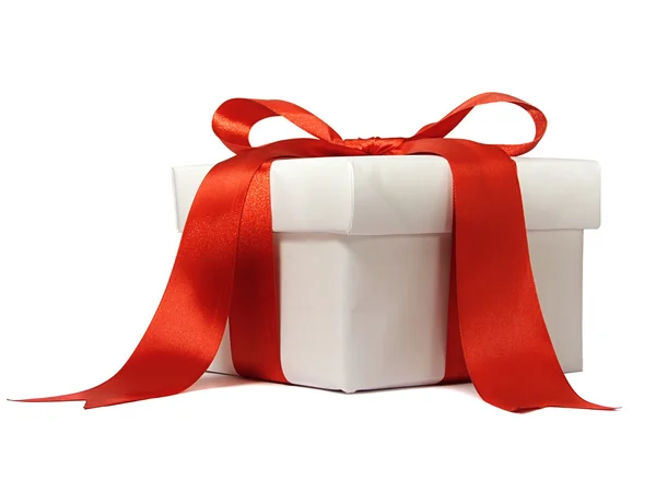 Witte geschenk met rode strik — Stockfoto