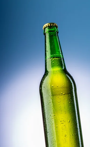 Green bottle of beer with drops — Stock Photo, Image
