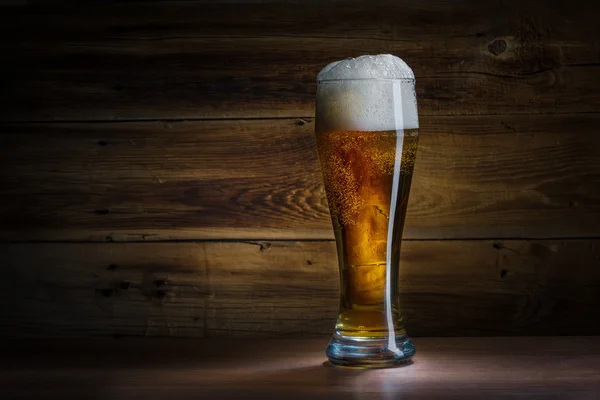 Beer glass on a wooden background — Stock Photo, Image