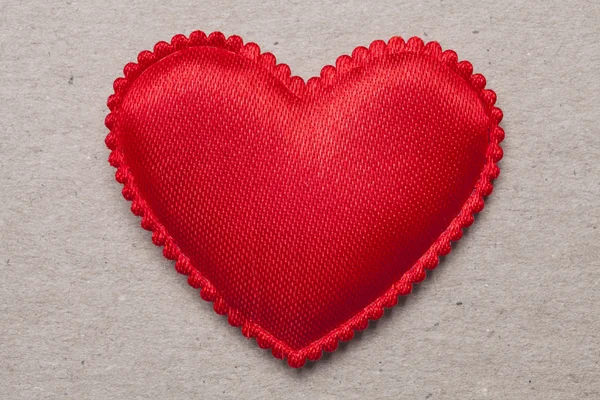 Red heart on vintage paper background — Stock Photo, Image