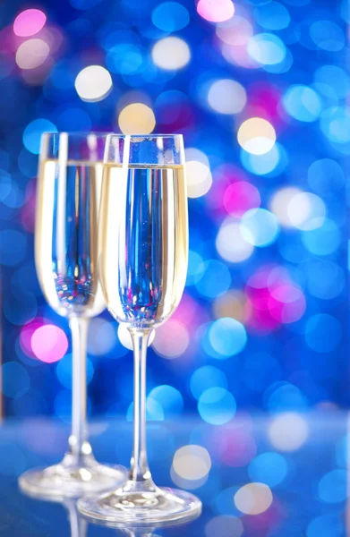 Two glasses of champagne with lights — Stock Photo, Image
