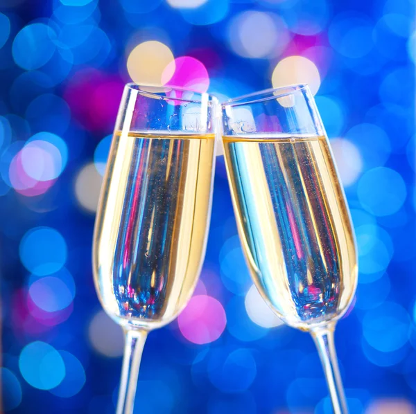 Two glasses of champagne with lights — Stock Photo, Image