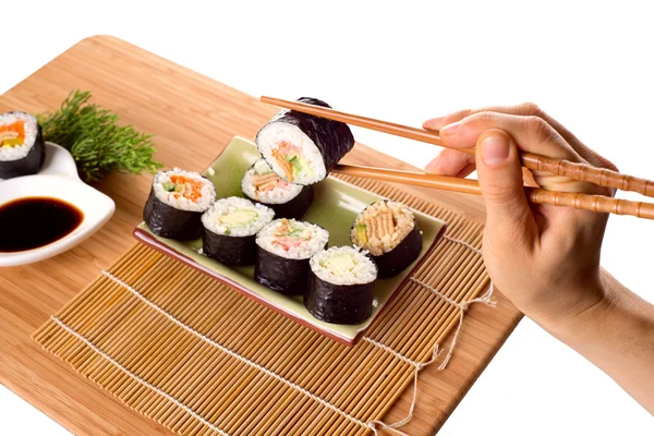Eating sushi rolls — Stock Photo, Image